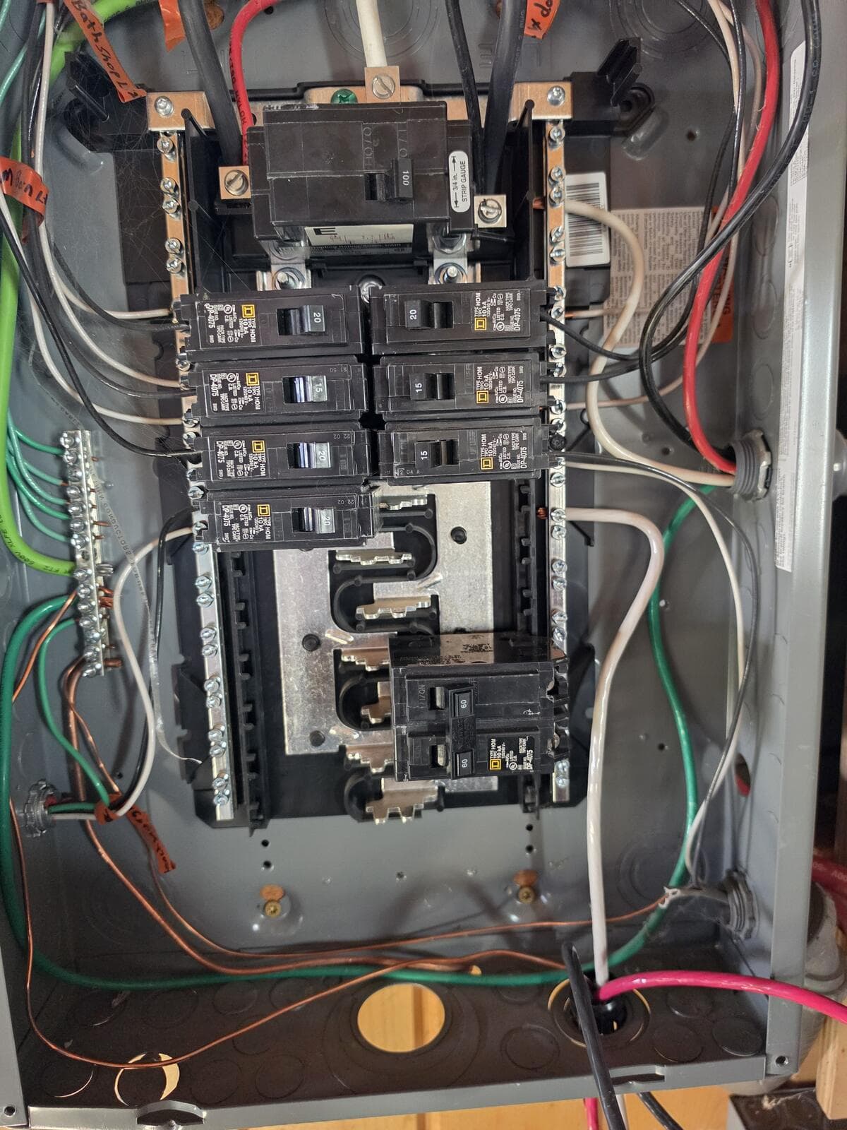 Homeline panel with a 60A two-pole breaker sitting slightly raised compared with the breakers above